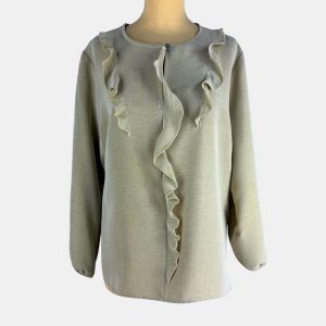 Blusa beige de volantes con manga larga y puño fruncido